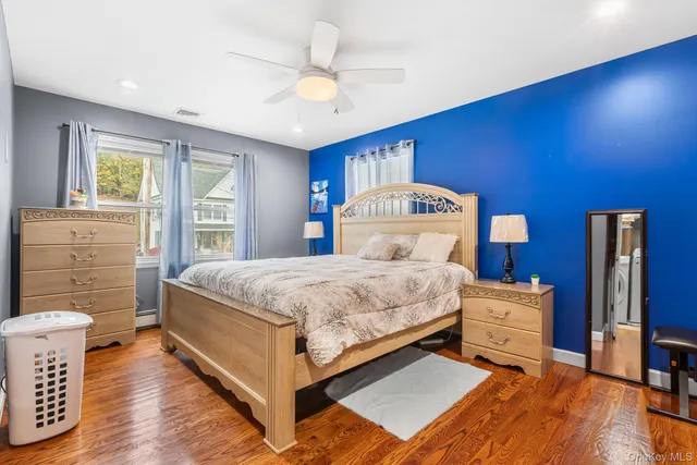 a bedroom with a bed and a dresser