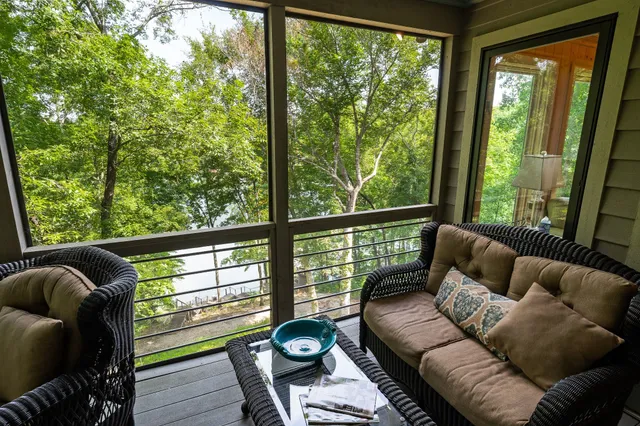 a bedroom with two beds and painting on the wall