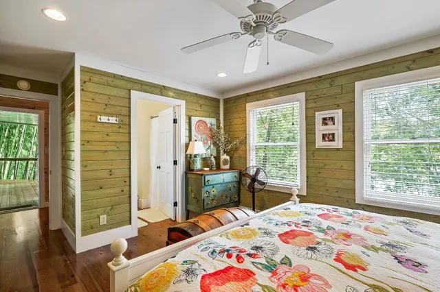 a view of balcony with wooden floor and fence