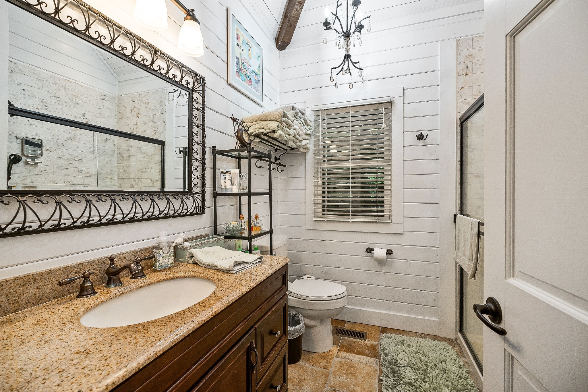 2541 Sparkman Town Road Doyle, TN 38559 - Photo 51 of 72 a bathroom with a granite countertop sink a mirror a toilet and a shower