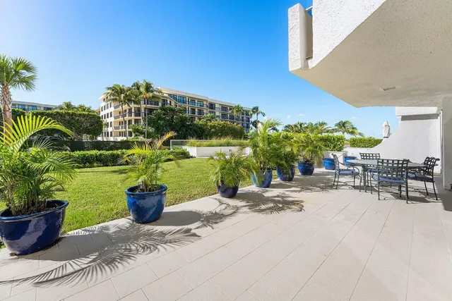 a building with potted plants in front of it