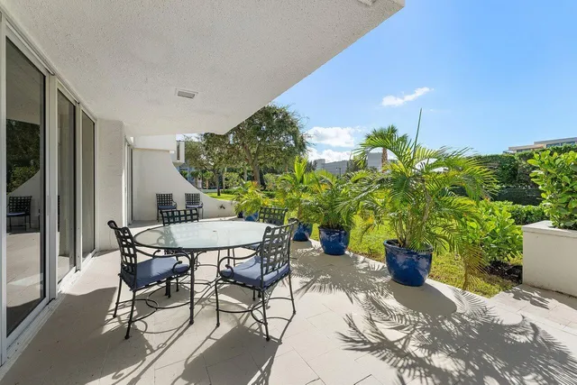 a view of a tables and chairs in patio
