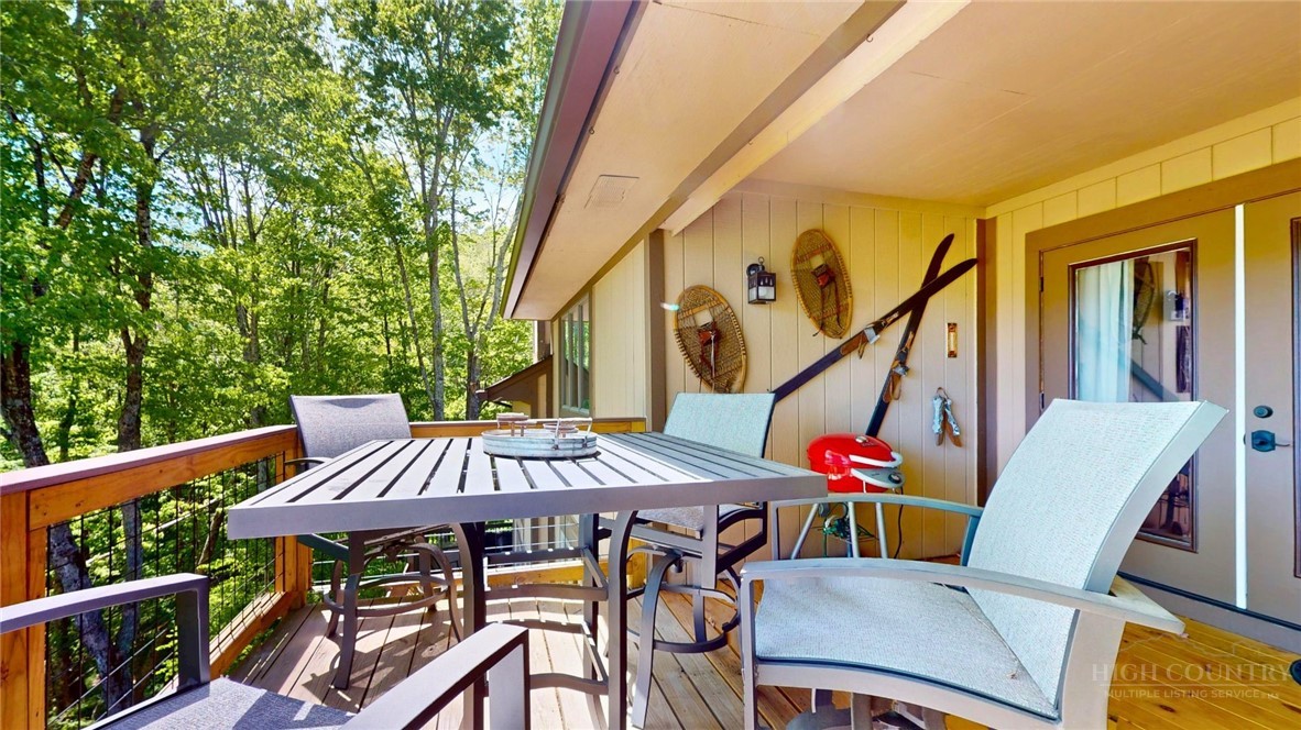 250 Ridgeview Road, Unit 43 Sugar Mountain, NC 28604 - Photo 21 of 21 a view of balcony with wooden floor and outdoor seating