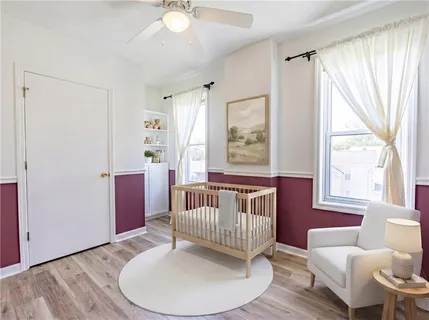 a view of a livingroom with furniture window and wooden floor