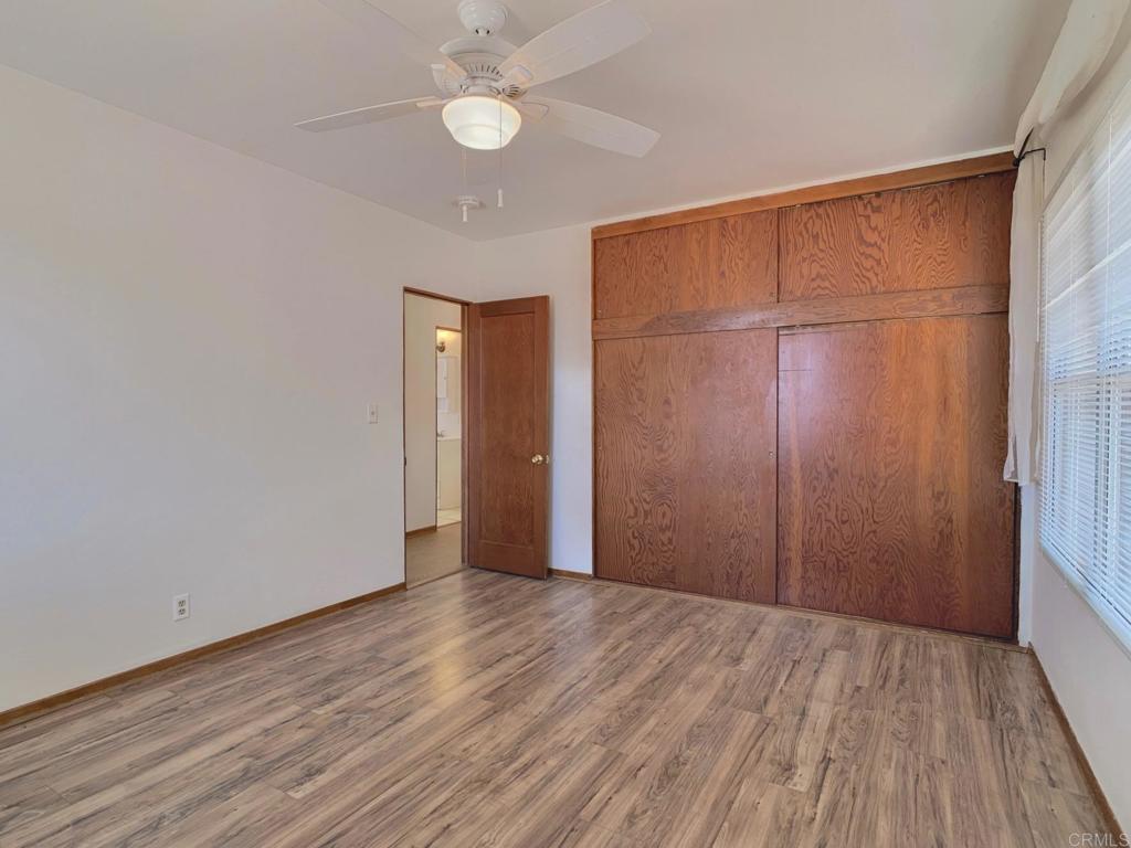 616 Alpine Heights Road Alpine, CA 91901 - Photo 16 of 50 a view of an empty room with wooden floor and a window