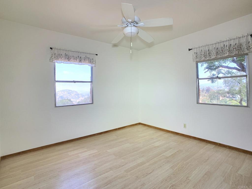 616 Alpine Heights Road Alpine, CA 91901 - Photo 17 of 50 wooden floor in an empty room with a window