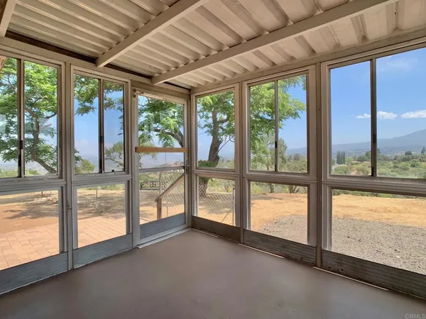 a view of an empty room with a large window