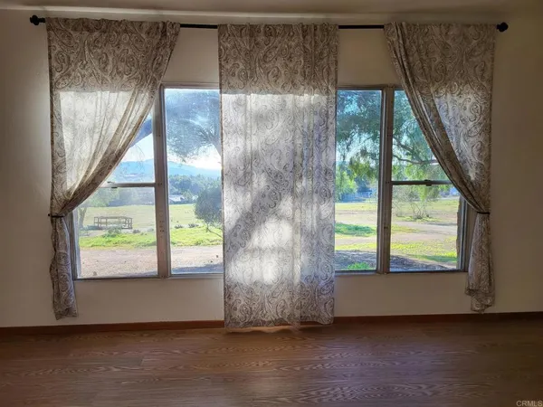 a view of an entryway with a floor to ceiling window