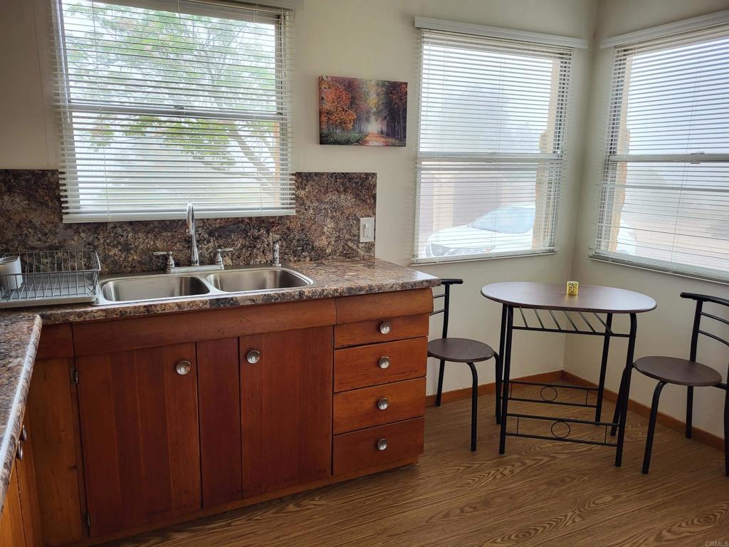 616 Alpine Heights Road Alpine, CA 91901 - Photo 8 of 50 a kitchen with a window a sink and chairs