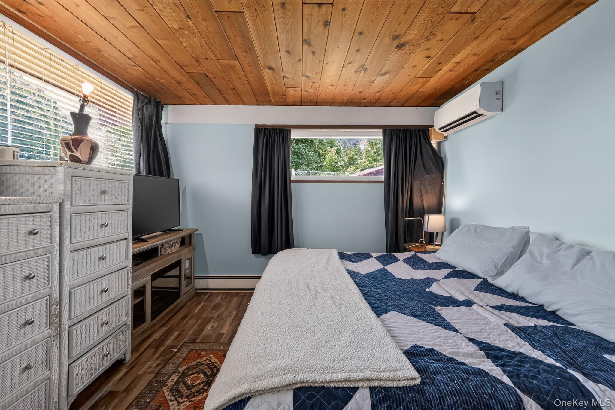 424 Laroe Road Chester, NY 10918 - Photo 11 of 43 Wood-finish ceiling with integrated lighting, light blue wall paint, and wood-finish flooring