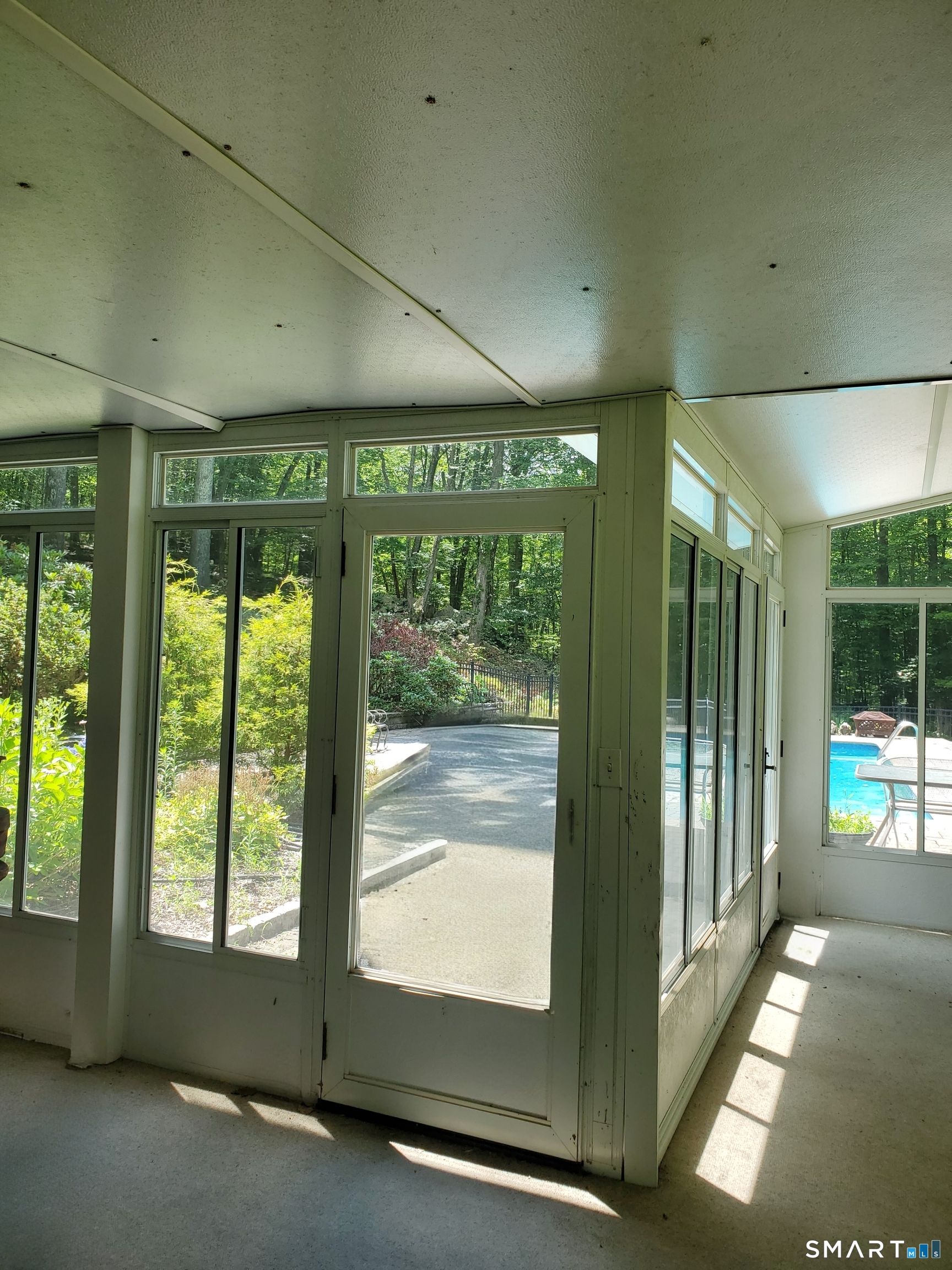 137 Guinea Road Monroe, CT 06468 - Photo 29 of 40 Lower Level - 3 Season Room Overlooking the Pool.