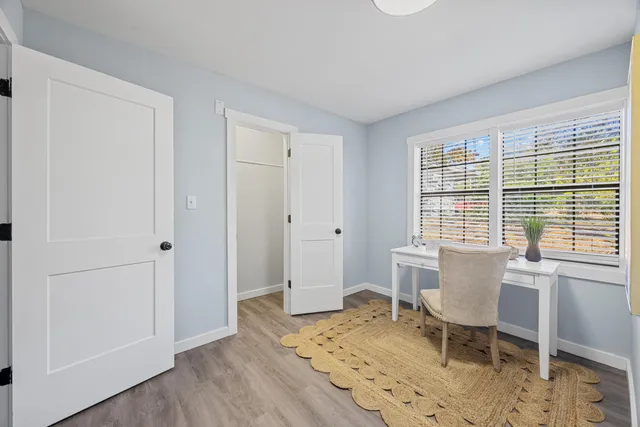 a view of a livingroom with furniture and a window