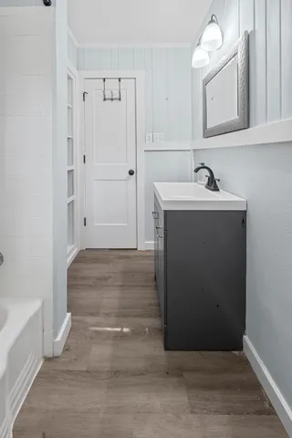 a bathroom with a sink and mirror
