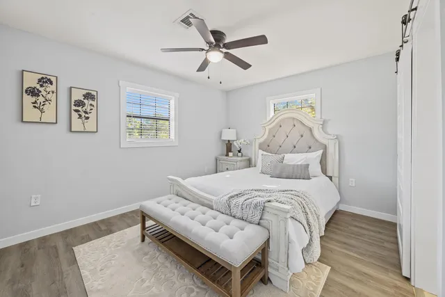 a bed room with a bed and a window