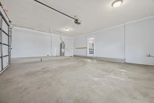 an aerial view of a house with a yard basket ball court and outdoor seating