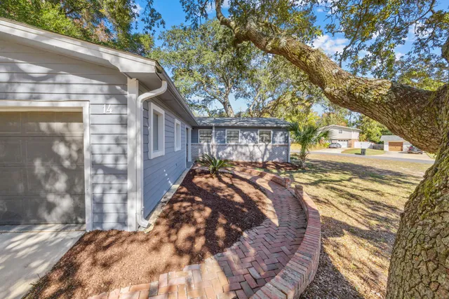 a view of a backyard of the house