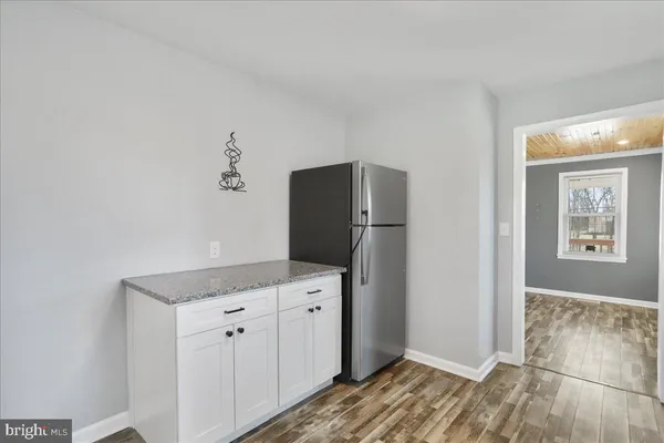 a kitchen with a refrigerator and countertop