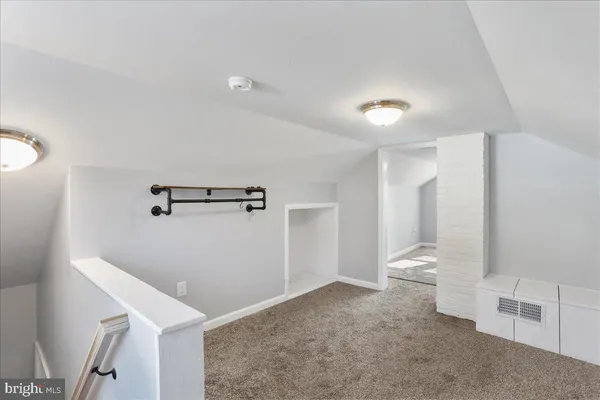 an empty room with a empty space and windows