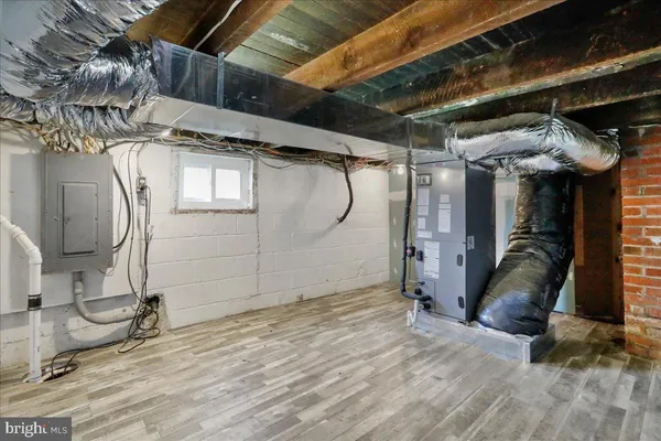a view of a room with wooden floor