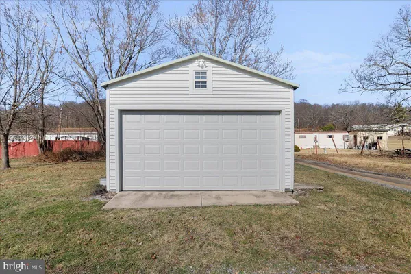 a view of an empty room with furniture
