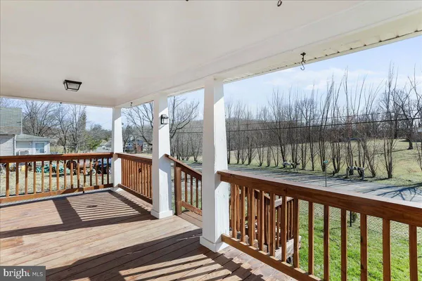 a view of a two chairs in the balcony