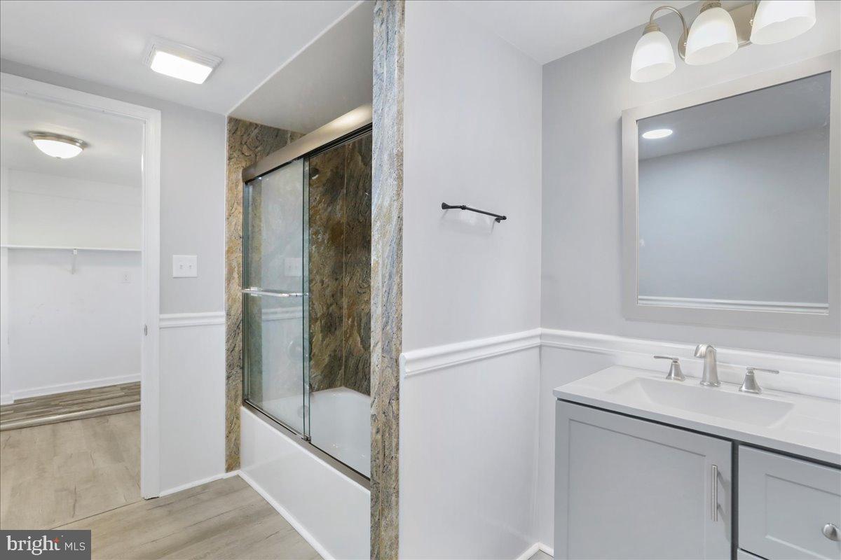 17 Turkey Hl Road Augusta, WV 26704 - Photo 8 of 33 a bathroom with a shower sink and mirror