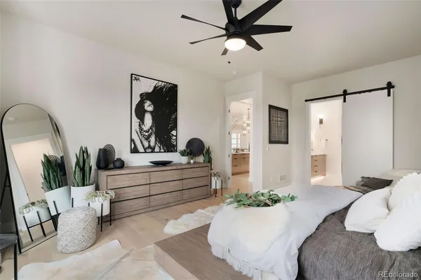 a view of living room with furniture and a large mirror