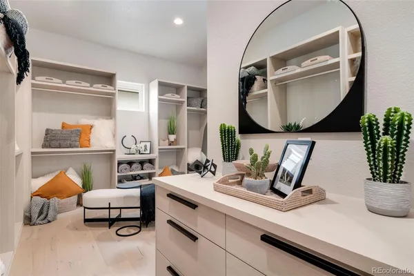 a bathroom with a sink mirror and vanity