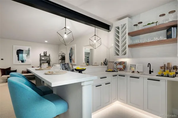 a kitchen with a sink a stove and cabinets