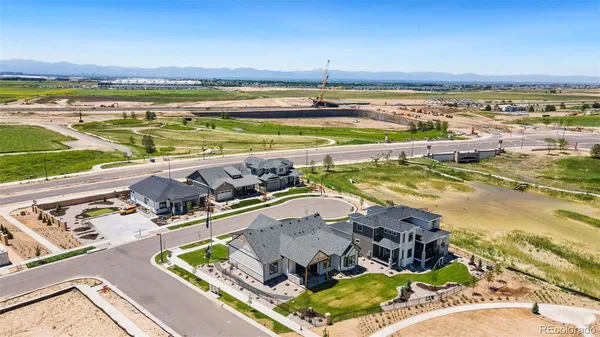 an aerial view of a house with a ocean view