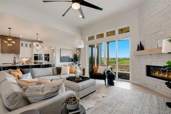 a living room with furniture fireplace and a flat screen tv