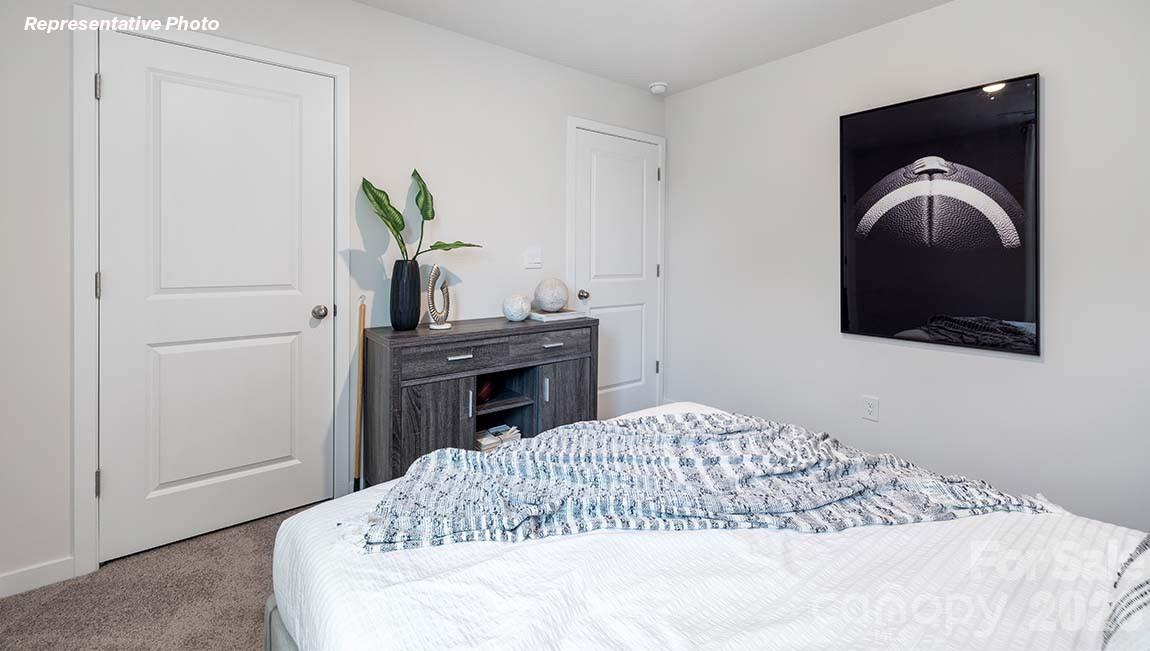 1431 Mammoth Road Hickory, NC 28602 - Photo 13 of 30 a bedroom with a bed and a television