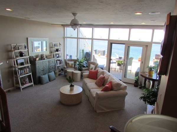 59 Oceanside Drive, Unit 59 Hull, MA 02045 - Photo 11 of 29 a living room with furniture and a large window