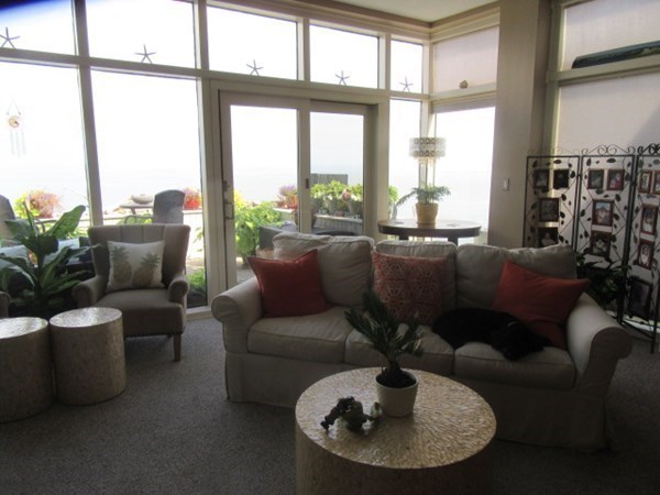 59 Oceanside Drive, Unit 59 Hull, MA 02045 - Photo 12 of 29 a living room with furniture and a large window