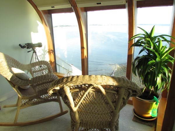 59 Oceanside Drive, Unit 59 Hull, MA 02045 - Photo 17 of 29 a bed sitting in a bedroom next to a window