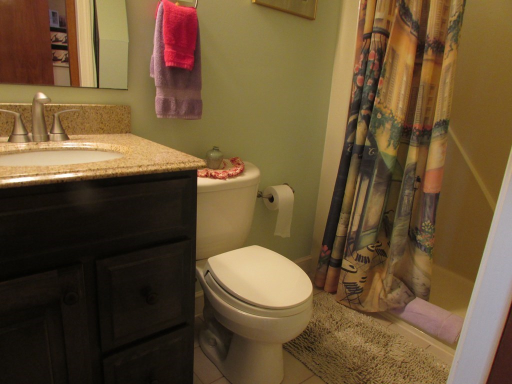 59 Oceanside Drive, Unit 59 Hull, MA 02045 - Photo 22 of 29 a bathroom with a sink and a toilet