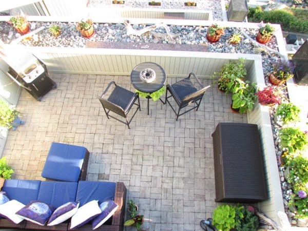 59 Oceanside Drive, Unit 59 Hull, MA 02045 - Photo 24 of 29 a view of entryway with outdoor seating and flowers