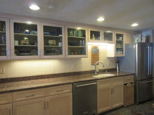 59 Oceanside Drive, Unit 59 Hull, MA 02045 - Photo 5 of 29 a kitchen with stainless steel appliances granite countertop a sink and a refrigerator