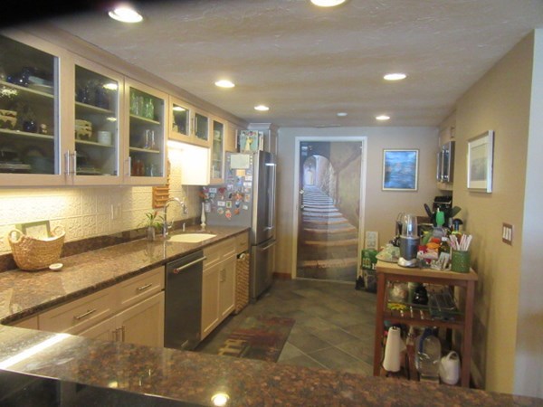 59 Oceanside Drive, Unit 59 Hull, MA 02045 - Photo 6 of 29 a kitchen with refrigerator and cabinets