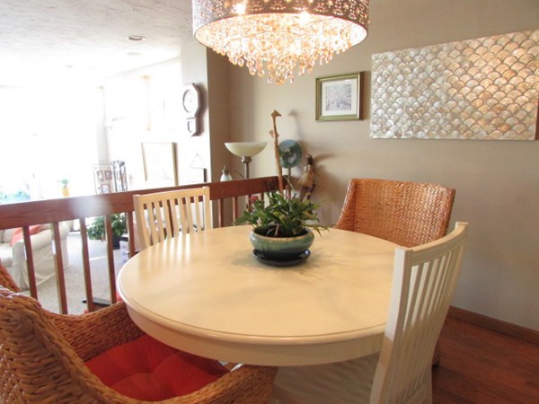59 Oceanside Drive, Unit 59 Hull, MA 02045 - Photo 8 of 29 a view of a dining room with furniture and wooden floor
