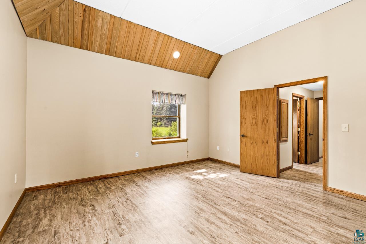 4800 Tower Road Moose Lake, MN 55767 - Photo 17 of 83 Vaulted wood-paneled ceiling with a recessed light fixture