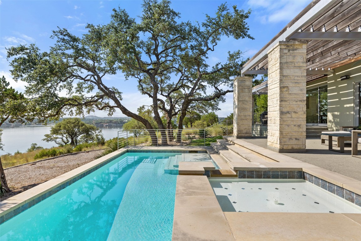 1417 Osprey Ridge Loop Lago Vista, TX 78645 - Photo 1 of 1 a swimming pool with outdoor seating