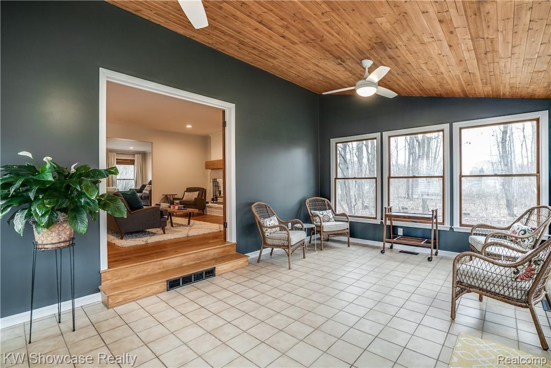 1422 North Hacker Road Howell, MI 48843 - Photo 24 of 44 Your new "escape room" features ceramic flooring, ceiling fans and is an ALL SEASON room! Escape with a good book and relax.