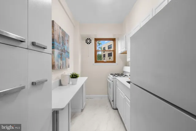 a kitchen with a sink and refrigerator
