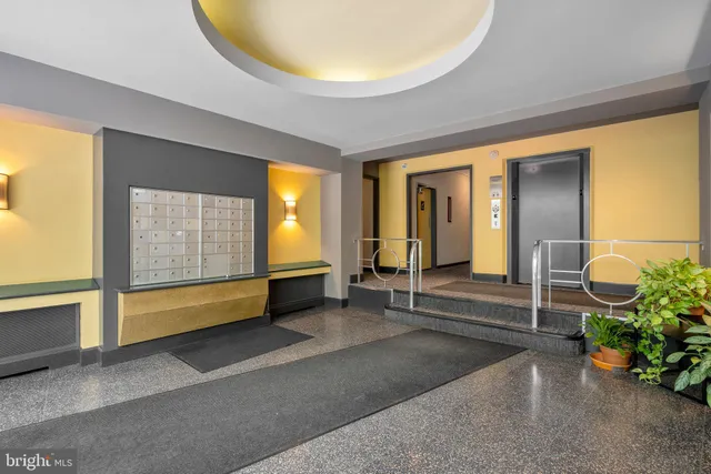 a view of an entryway with wooden floor and a window
