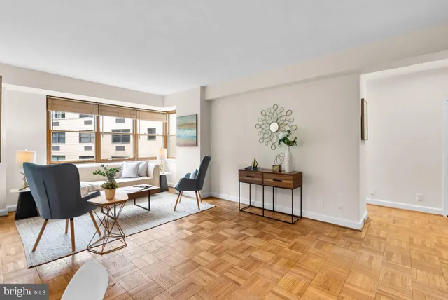a living room with furniture and a window