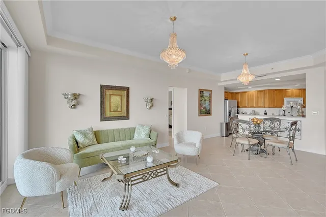 a living room with furniture wooden floor and a large window