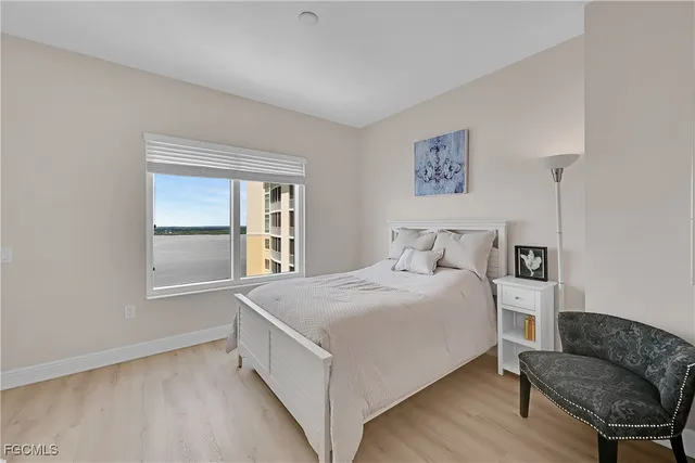 a bedroom with a bed and a couch