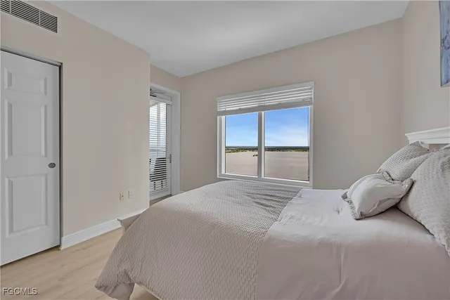 a large white bed in a white room