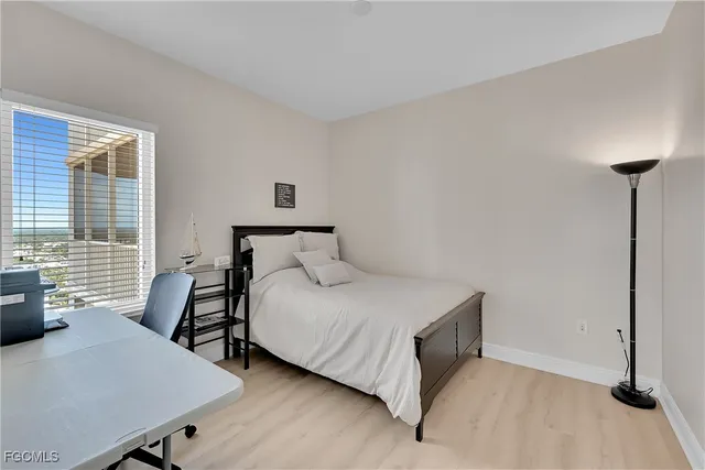 a bedroom with a bed and a table